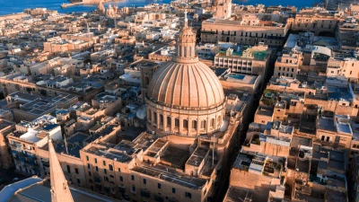 Valletta at sunset with the Carmelite basilica dome and St Paul's Pro-Cathedral spire