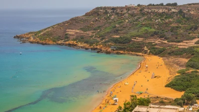 Aerial view of Ramla Bay in Gozo with its red sand and turquoise water