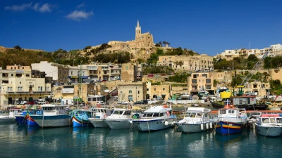 Mġarr Harbour in Gozo with the Church of Our Lady of Lourdes above it