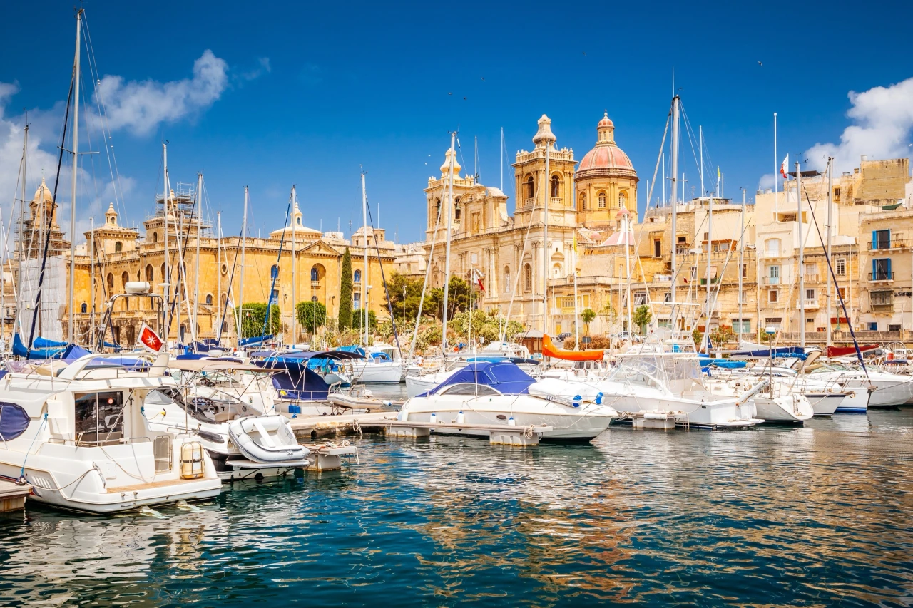 Yachts moored in Vittoriosa marina below St Lawrence's Church