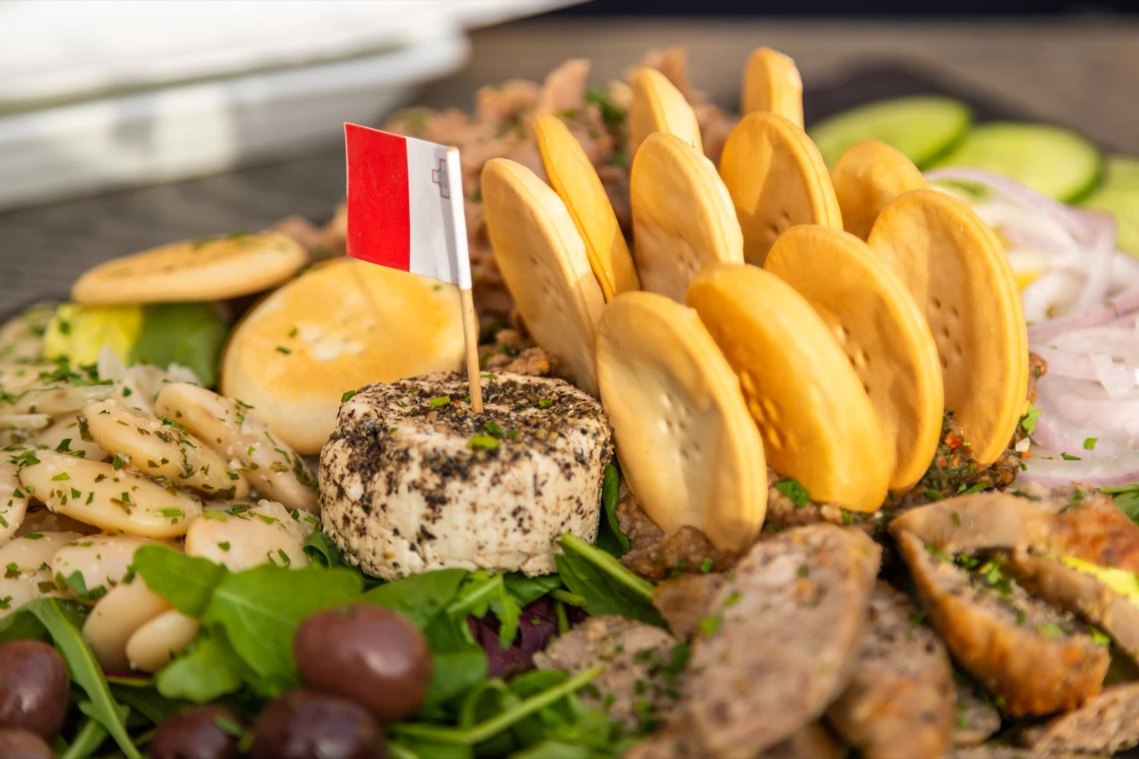 Traditional Maltese platter with cheese, beans, sausage and biscuits, served in Birgu