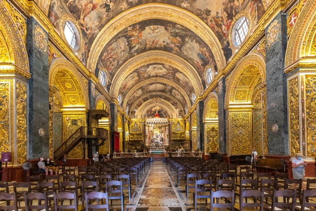 The richly decorated nave and ceiling frescoes of St John's Co-Cathedral